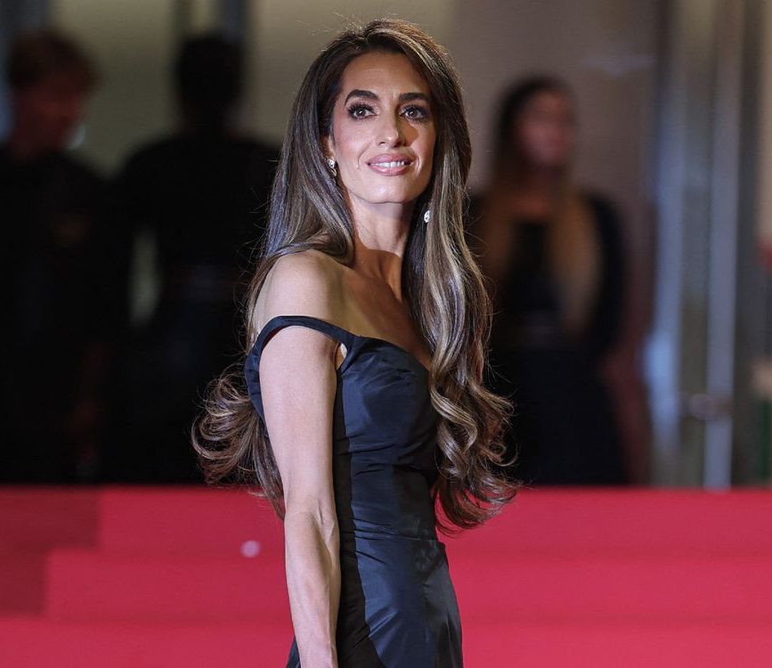 Amal Clooney Shines in Vintage Gold Gown at Cartier Awards, Balancing Glamour with Advocacy