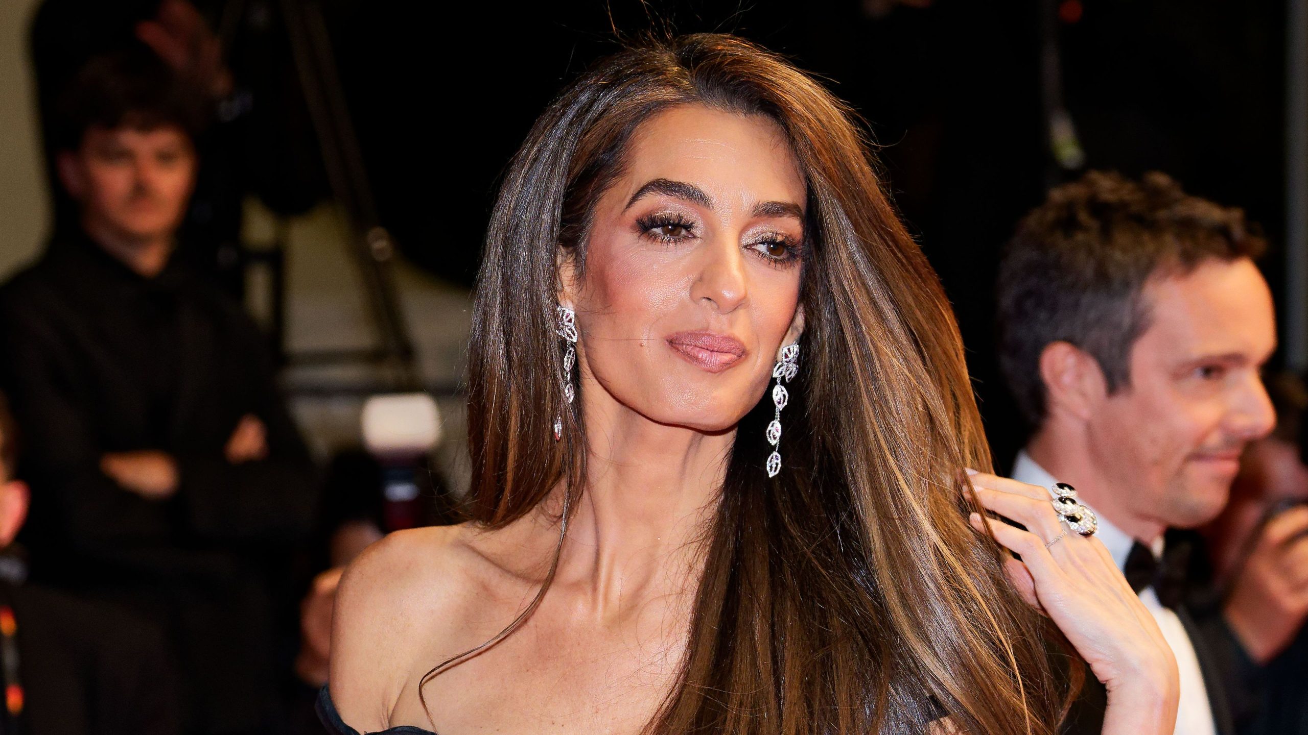 Amal Clooney Shines in Vintage Gold Gown at Cartier Awards, Balancing Glamour with Advocacy